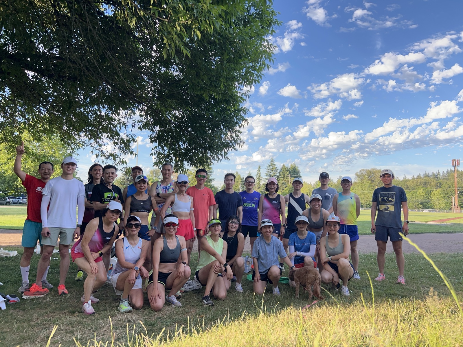 A large Seattle United Runners group gathered beside a track